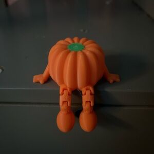 Orange Pumpkin Toy with Green Accent